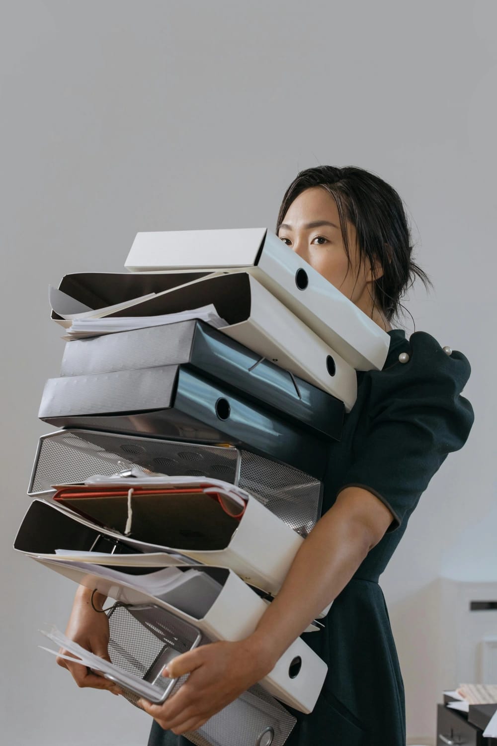 Photo by cottonbro studio: https://www.pexels.com/photo/a-woman-holding-a-pile-of-file-folders-6538616/