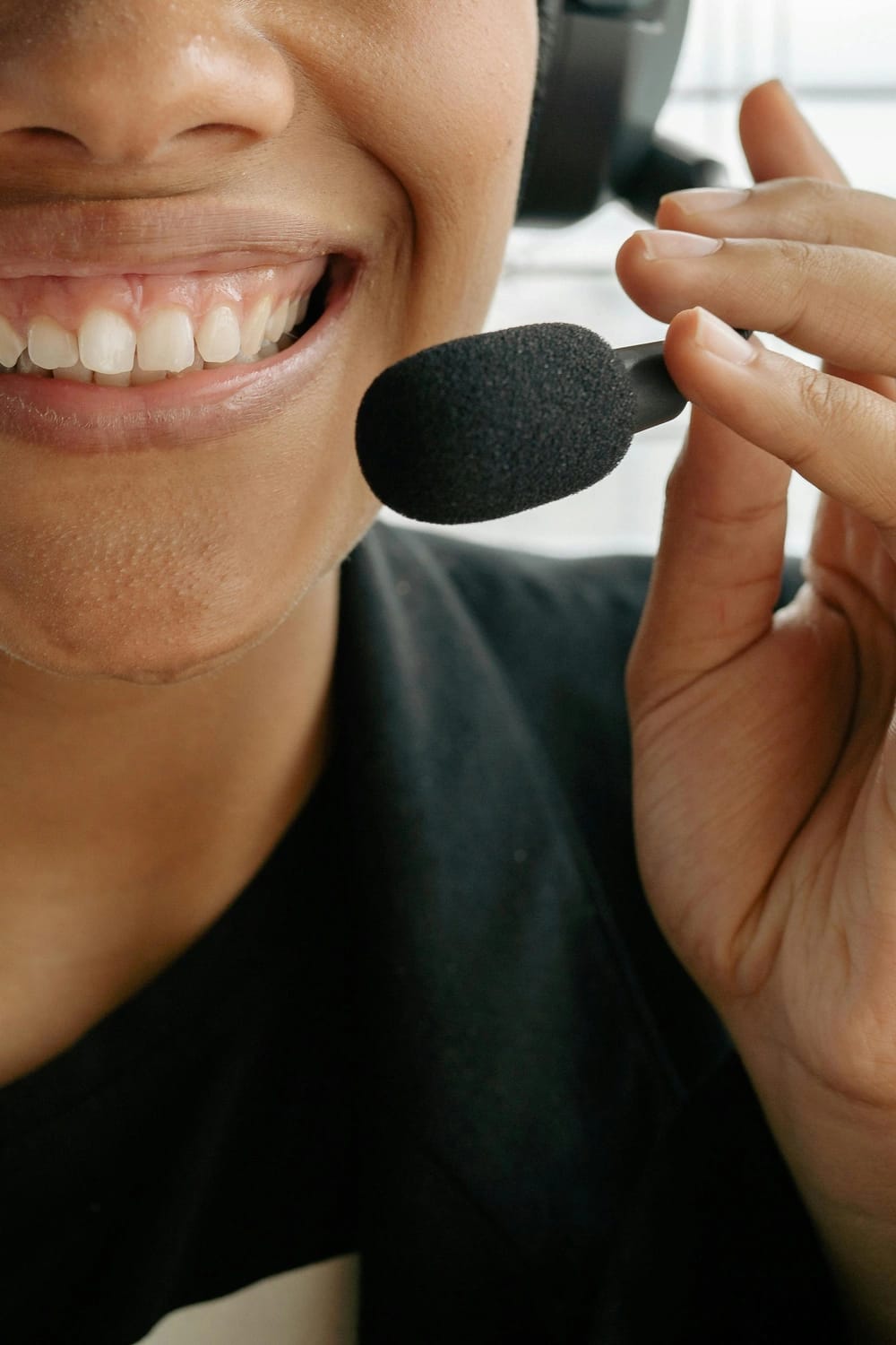 Photo by Yan Krukau: https://www.pexels.com/photo/close-up-photo-of-a-smiling-woman-holding-microphone-8866772/