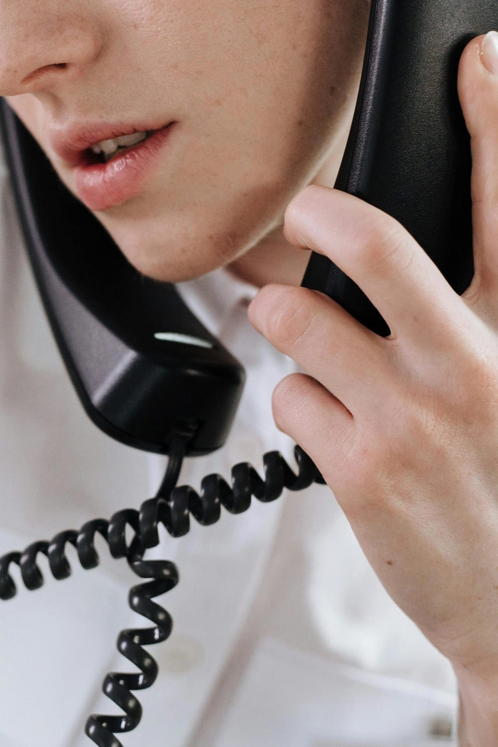 Photo by Ron Lach : https://www.pexels.com/photo/woman-talking-on-telephones-8691839/