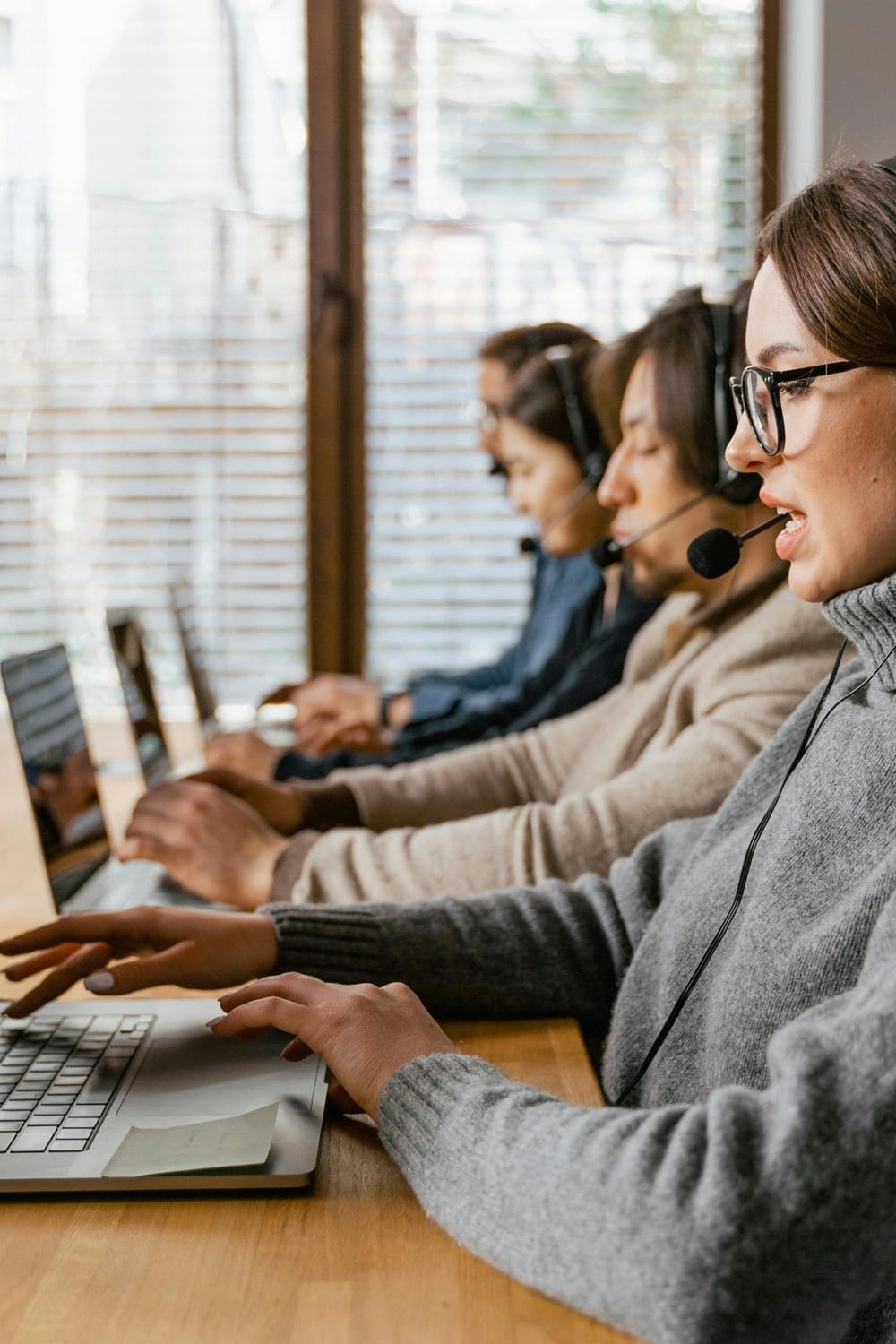 Photo by MART PRODUCTION: https://www.pexels.com/photo/a-woman-in-gray-sweater-attending-a-call-7709146/